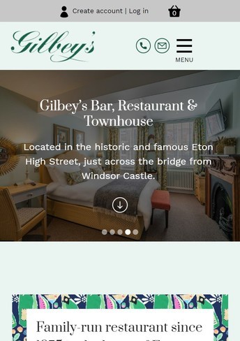 A responsive web design for bar and restaurant shown on a mobile device.