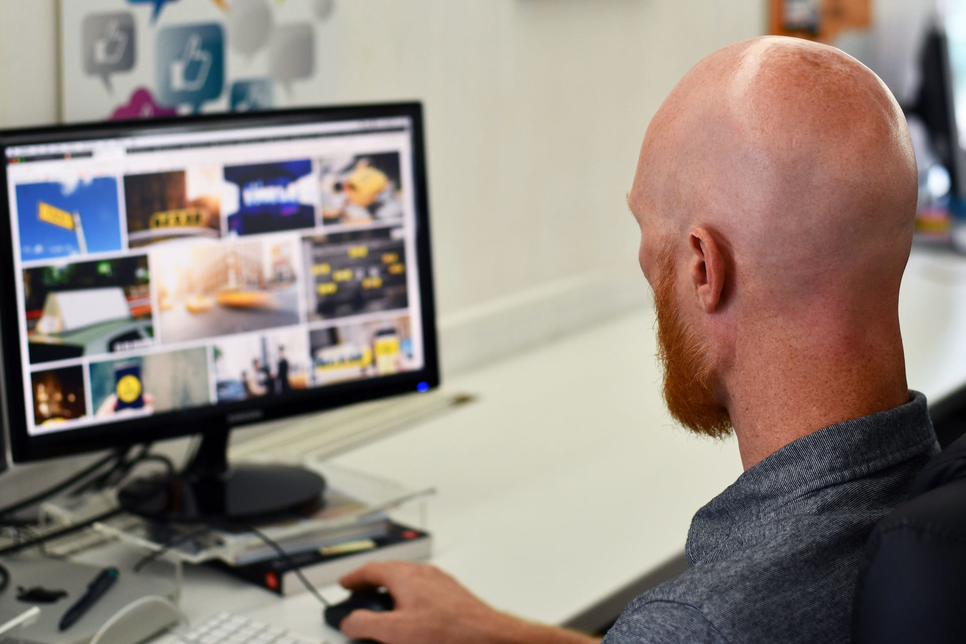 A website designer looking at his computer
